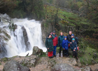 Rosie, Phil, Anne, Matthew, Pete, Eleanor and Ken at a waterfall